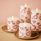 White Porcelain with Metallic Raspberry Hearts Flameless Candle Pillar
