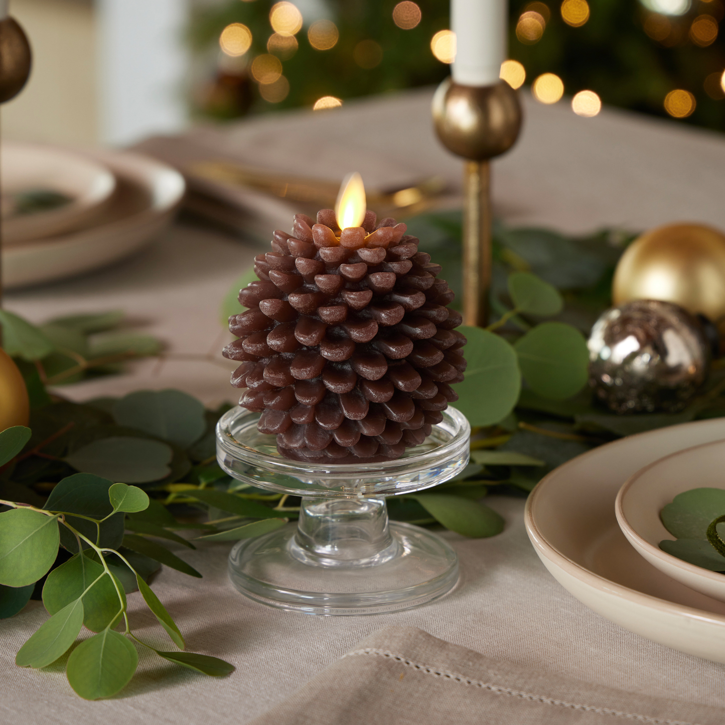 an image of Luminara's pine cone candles