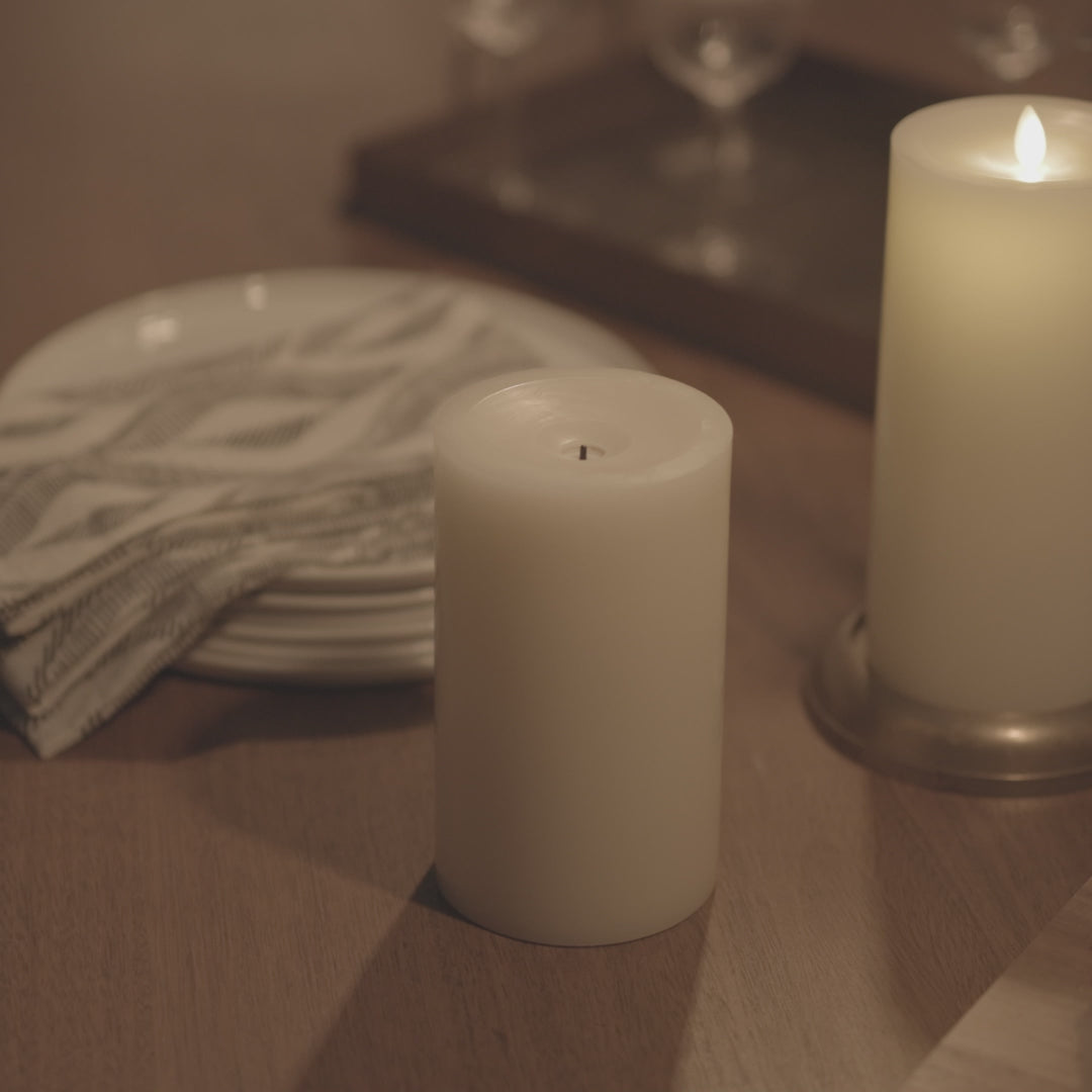 a video of Luminara's wick to flame pearl ivory flameless candles