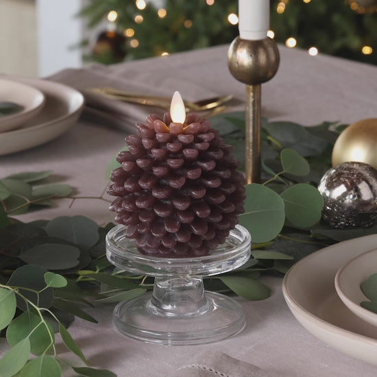 a video of Luminara's pine cone candles